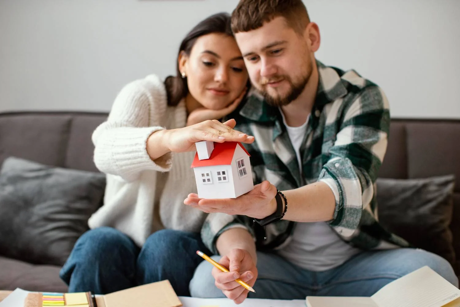 Couple with keys to their home